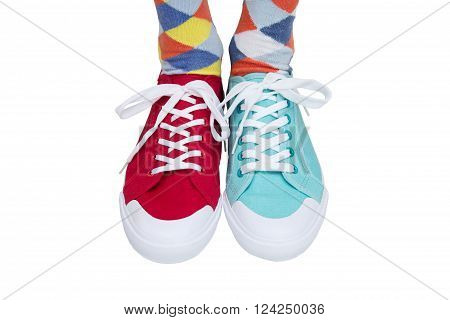 wearing funny socks and different sneakers on legs
