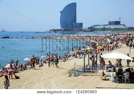 SPAIN, BARCELONA, JUNE, 27, 2015 - Barceloneta beach of hot summer day in Barcelona, Spain