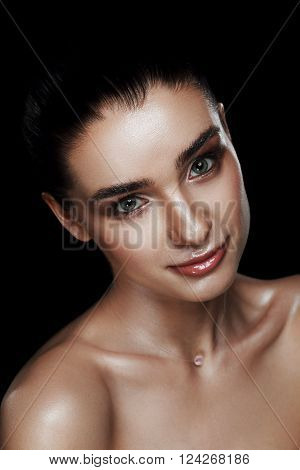 Beauty Portrait Of Pretty Woman With Strobing Makeup. Wet Body Effect. Strobing Or Highlighting Make