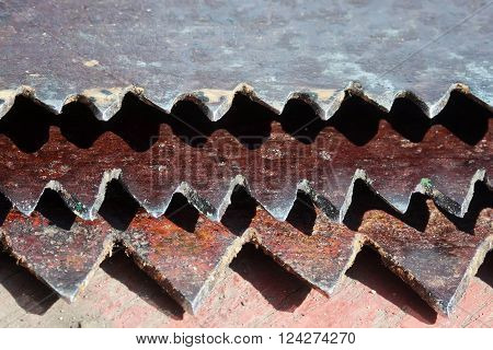 the sharp teeth of rusted old metal saws