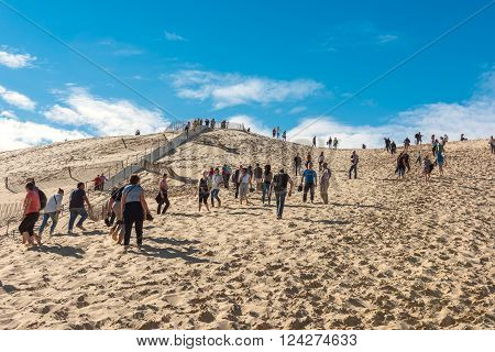 People Visiting The Highest Sand Dune Of Pyla In Europe