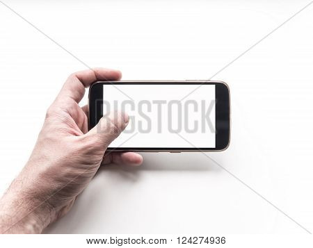 Hand holding mobile smartphone with blank screen on white background