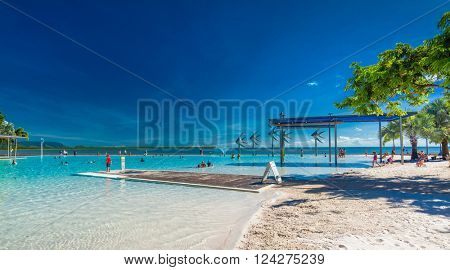 CAIRNS, AUSTRALIA - 27 MARCH 2016. Tropical swimming lagoon on the Esplanade in Cairns with artificial beach, Queensland, Australia.