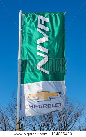 SAMARA RUSSIA - MARCH 20 2016: Niva Chevrolet dealership sign against blue sky. Chevrolet is a American automobile manufacturer