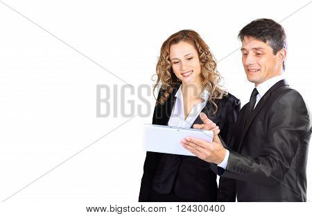 Successful young business team. Man and woman isolated over white with tablet.
