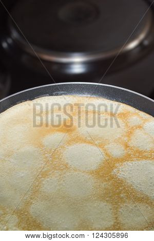Frying pan with pancake baking on it
** Note: Soft Focus at 100%, best at smaller sizes