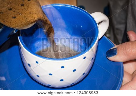 Pouring hot turkish coffee in coffee cup
** Note: Soft Focus at 100%, best at smaller sizes