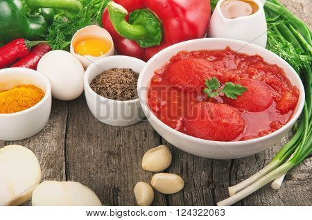 Ingredients for cooking healthy food on a wooden table with a free space for the object. Healthy food