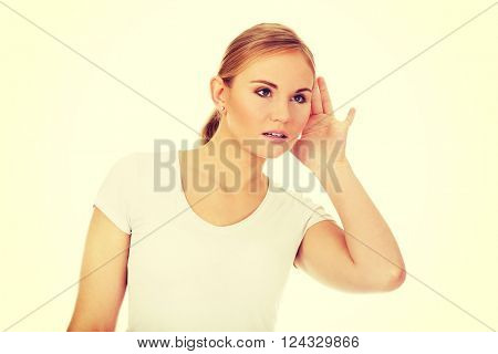 Shocked young woman overhears conversation