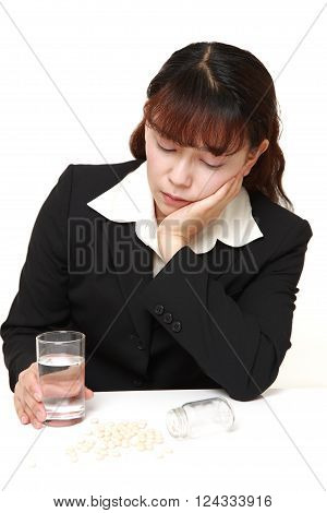 portrait of Asian businesswoman suffers from melancholy