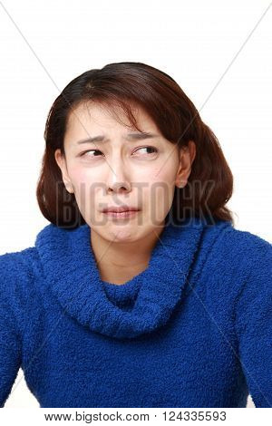 portrait of perplexed woman on white background