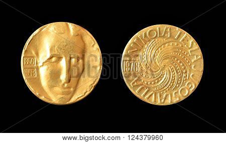 YUGOSLAVIA - CIRCA 1976 : Gold medallion, made by Zlatara Majdanpek - Yugoslavia, that shows portrait of scientist Nikola Tesla.