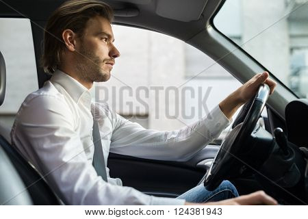 Young man driving his car
