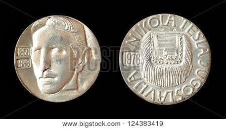 YUGOSLAVIA - CIRCA 1976 : Silver medallion, made by Zlatara Majdanpek - Yugoslavia,  that shows portrait of scientist Nikola Tesla.
