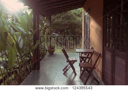 Brazil traditional house. table and chairs on the terrace at dawn. Brasil