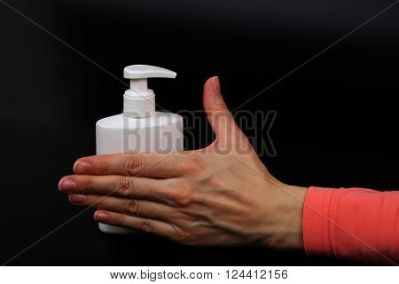 Liquid Soap Dispenser And A Human Hand