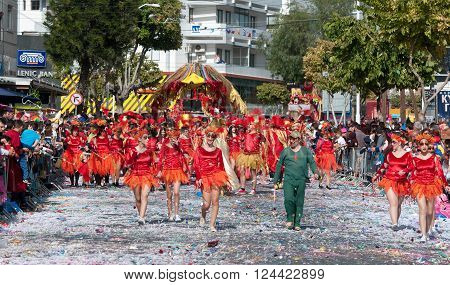 LIMASSOL CYPRUS - MARCH 13: Happy people in teams dressed with colorfull costumes at famous Limassol Carnival Parade on March 13 2016 in Limassol town Cyprus.