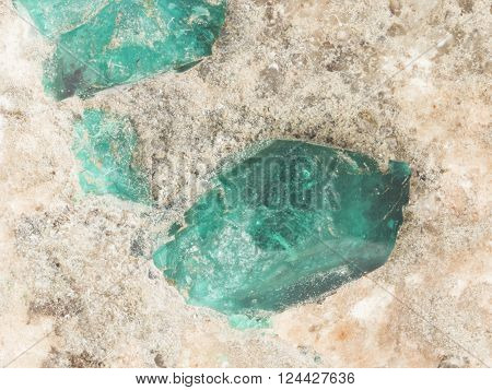 Raw dioptase crystals in stone macro selective focus