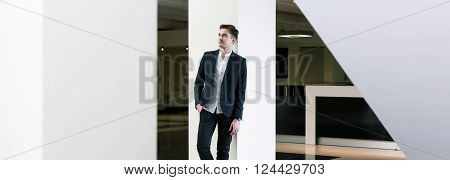 Shot of a young man wearing a suit