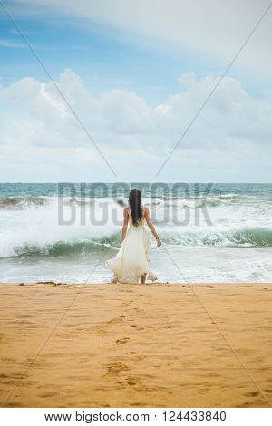 Happy girl in the coast of the beautiful island