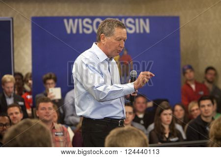 Madison Wisconsin USA - March 28 2016: Republican presidential candidate John Kasich speaks to a group of supporters during a free public town hall event before the Wisconsin presidential primary in Madison Wisconsin.