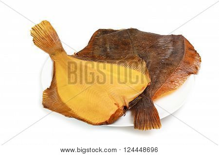 Two hot smoked flatfish on plate isolated on white