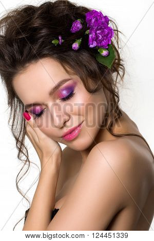Portrait of young beautiful female holding touching her face. Bright spring or summer modern fashion make up. Pink lips and smokey eyes. Skin treatment or natural cosmetics concept