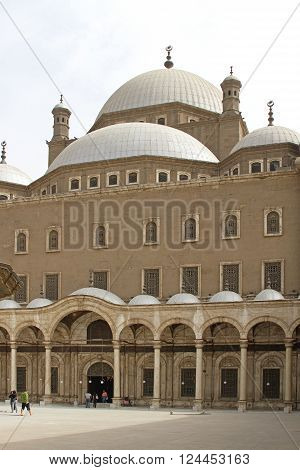 CAIRO EGYPT - FEBRUARY 24: People Going in Mosque of Muhammad Ali in Cairo on FEBRUARY 24 2010. Beleivers in Coutyard of Alabaster Mosque at Citadel in Cairo Egypt.