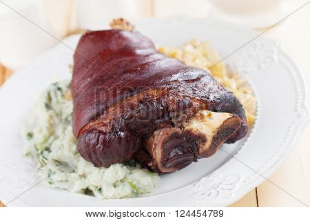 Roasted pork knuckle with sour cabbage and mashed potato