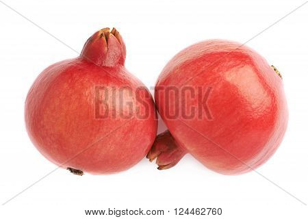 Two pomegranate punica granatum fruits composition isolated over the white background