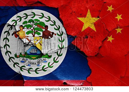 flags of Belize and China painted on cracked wall