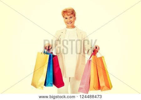 Happy business woman holging shopping bags