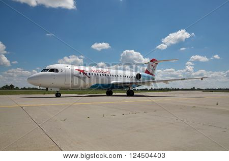 Borispol Ukraine - July 5 2014: Austrian Airlines Fokker-70 passenger plane taxiing to the terminal after landing