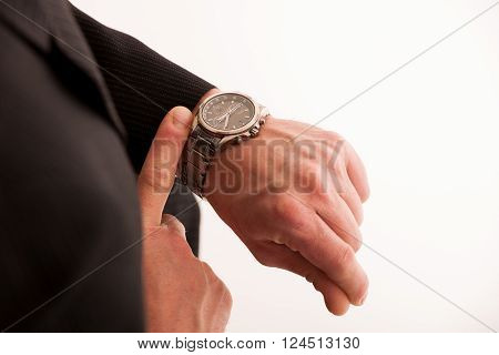 Successful Businessman In Formal Suit Chacking Time On Wrist Watch.