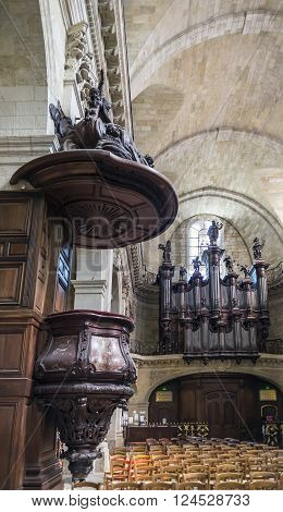 Bordeaux France - March 26 2016. The pipe organ in nave of Notre-Dame church. Notre Dame is the most baroque and romanesque style in Bordeaux Aquitaine. France.