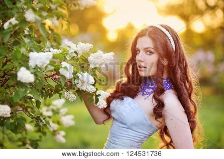 tiful young girl, shot against setting sun