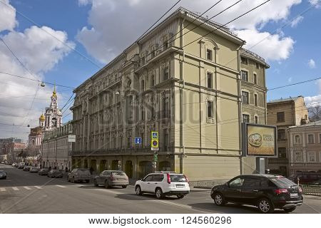 MOSCOW, RUSSIA - MARCH 21, 2016: View of the apartment building engineer Osip Vilner, Staraya Basmannaya Street, 12, Building 1, against the backdrop of the Temple of the Martyr Nikita, landmark