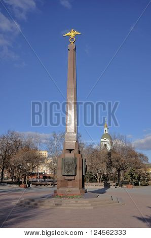 MOSCOW, RUSSIA - MARCH 14, 2016: Monument Border Guards of Fatherland on the Yauzskaya square landmark on the background Bell tower Trinity in Serebryaniki