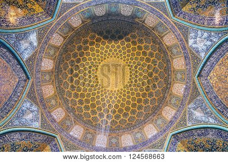 Isfahan, Iran - December 13, 2015: Sheikh Lotfollah Mosque at Naqhsh-e Jahan Square in Isfahan, Iran. Ceiling view
