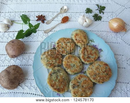 Potato goutweed cutlets on the plate, cooking food for a vegetarian diet