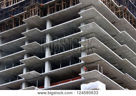 Seattle, WA - March 10: Construction Worker works on Unfinished High-rise Building in Seattle, WA, March 10, 2016