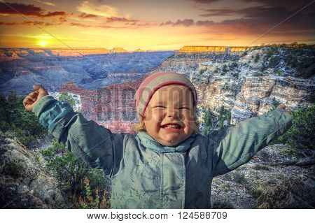 girl queen of the Grand Canyon USA. child arms outstretched to the sides of joy.