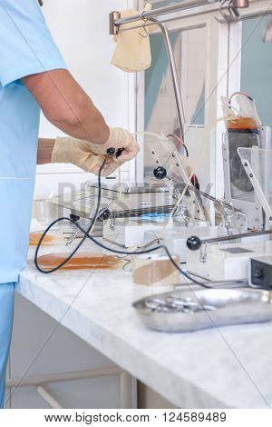 The process of monitoring the quality of the blood. Instrumental laboratory manipulations