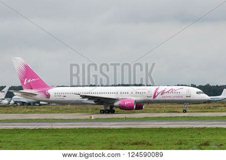 DOMODEDOVO RUSSIA - JULY 20: Aircraft operated by Vim Airlines taxiing at Moscow airport in Domodedovo on July 20 2013. The company in its fleet has 11 aircraft Boeing-757-200