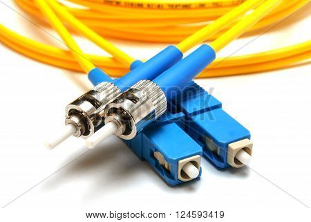 single-mode optical connector LC and ST-type isolated on a white background. Close-up.
