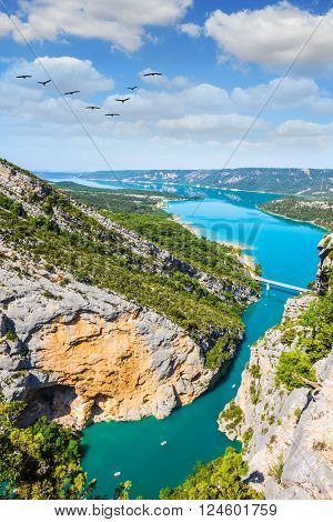 The largest alpine canyon Verdon spring. Emerald water of the river is flowing at the bottom of the gorge. Canyon of Verdon, Provence, France
