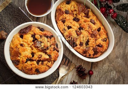 Bread pudding in a white ramekin top view flat lay