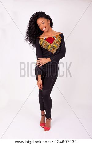 Beautiful African American woman fashion portrait over gray background