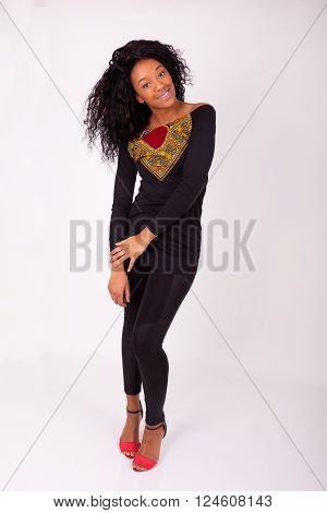 Beautiful African American woman fashion portrait over gray background