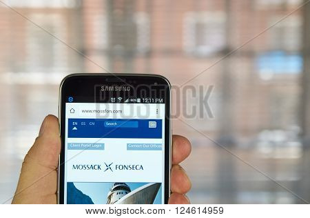 MONTREAL CANADA - APRIL 5 2016 : Mossack Fonseca page on mobile phone. Mossack Fonseca is a Panamanian law firm well known for the biggest leak in the history called The Panama Papers.
